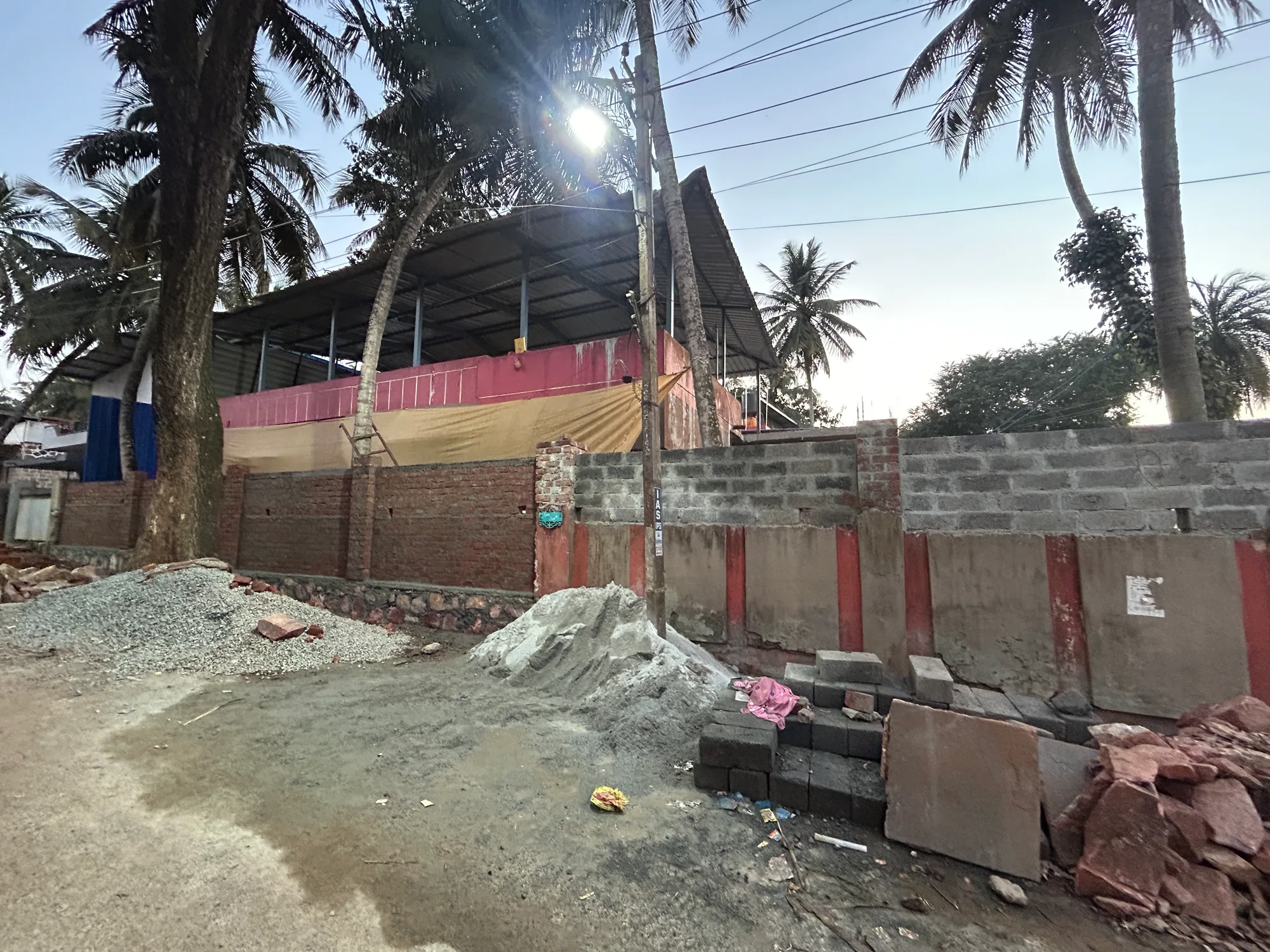 Site photograph during construction: street view at dusk