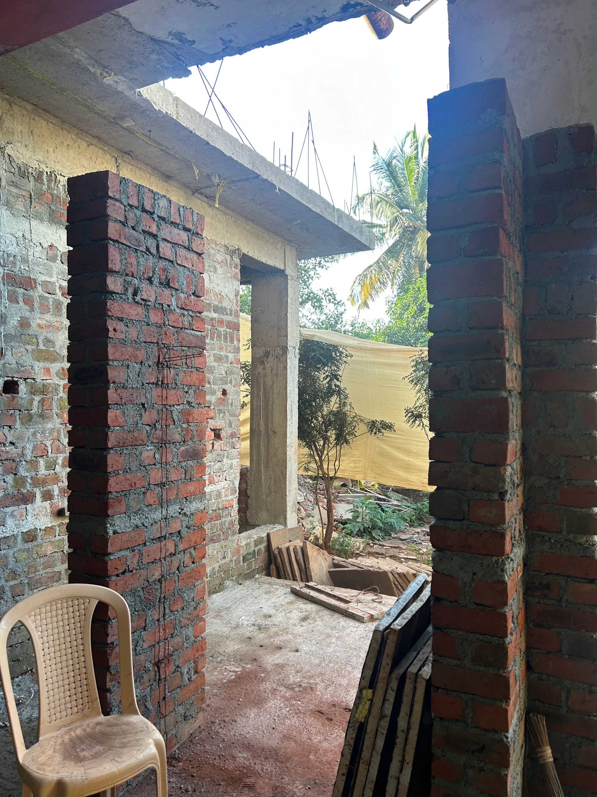 Site photograph during construction: brick piers, the view through